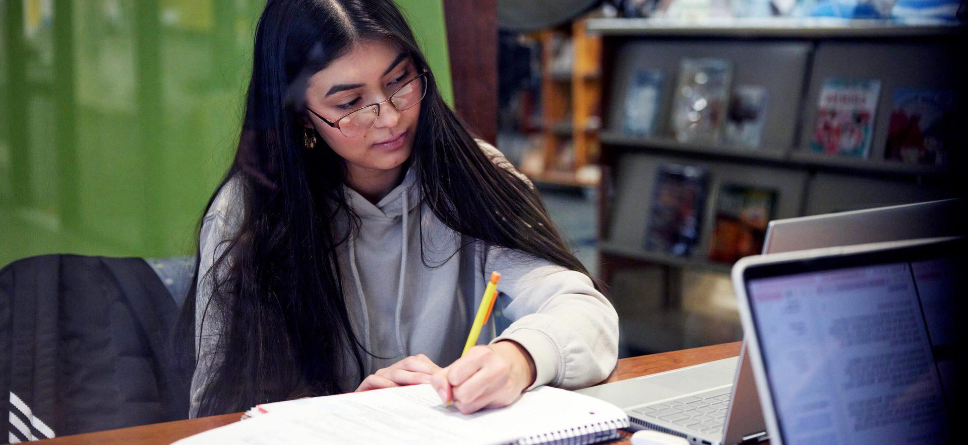 Student looking at class work.